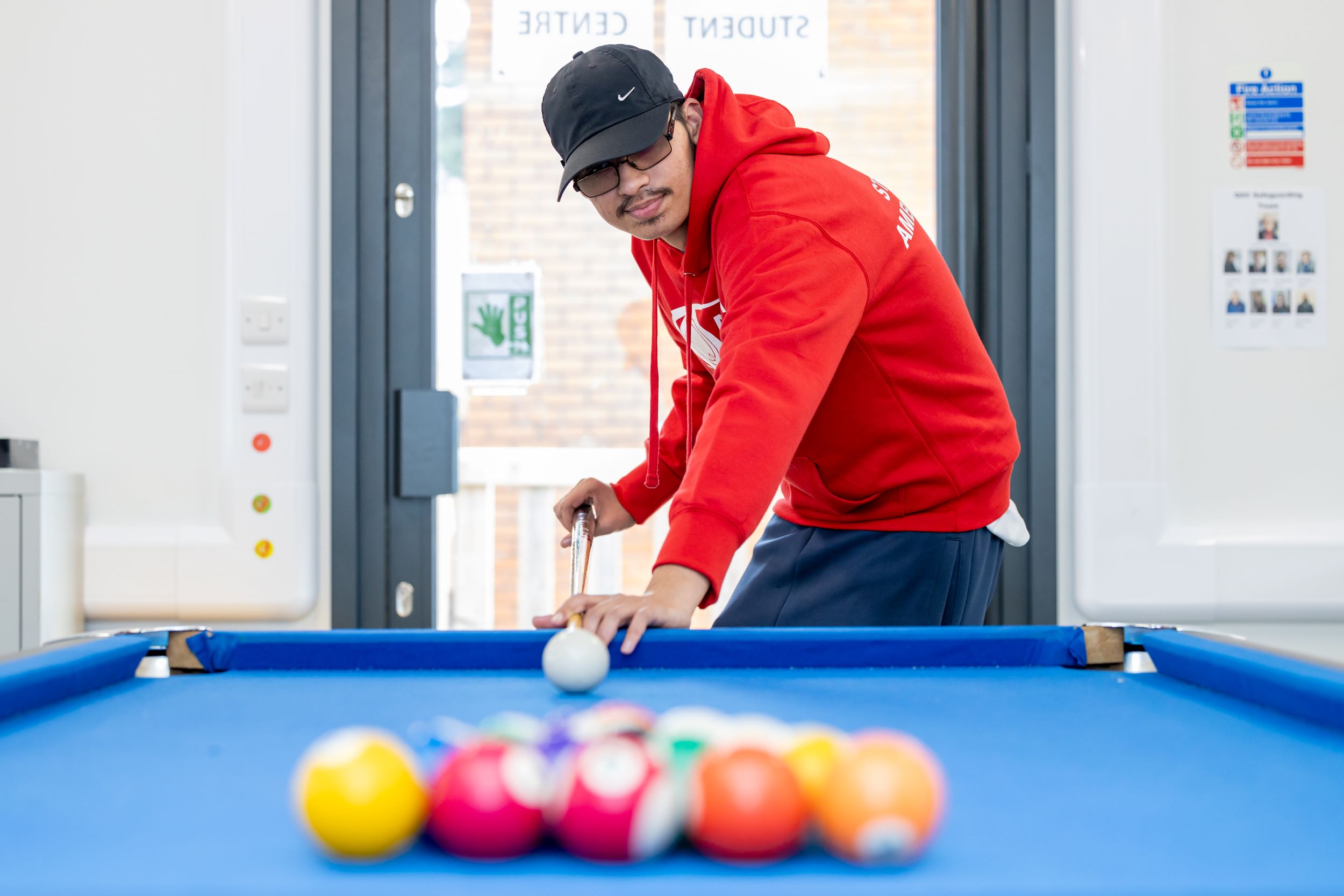 Student playing pool 