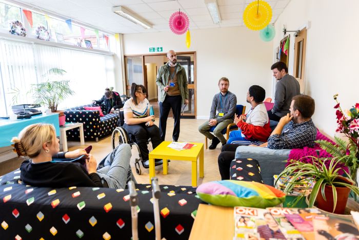 Staff and clients chat in the Community Services Hub  