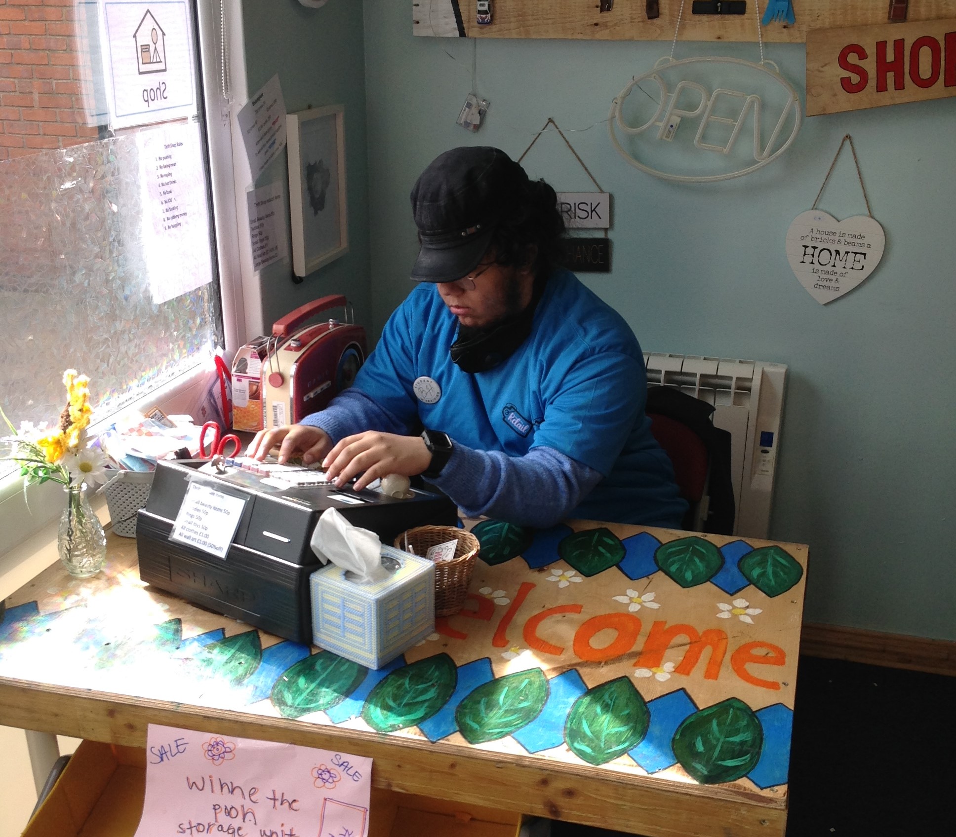 Brendan working on the till