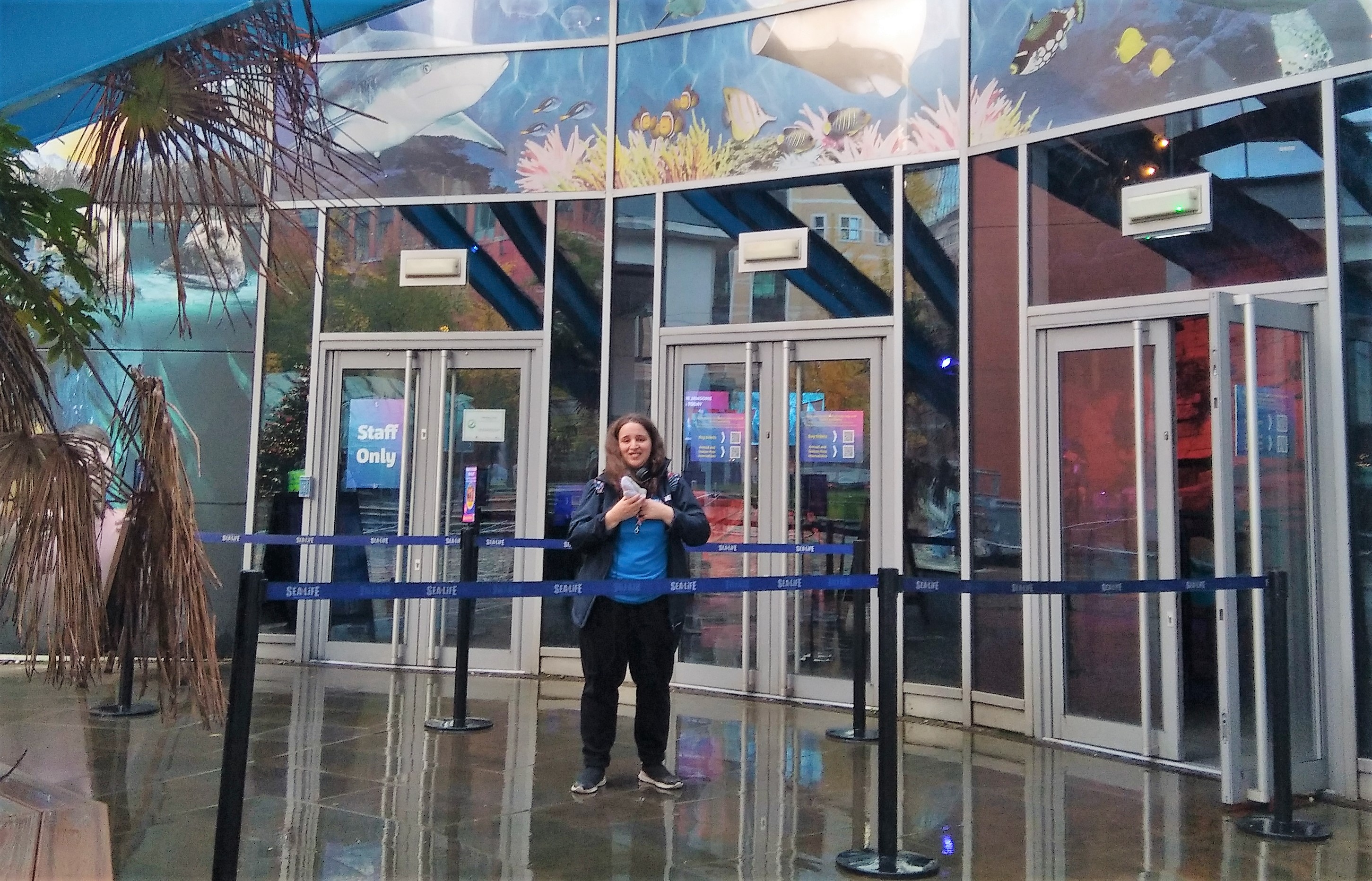 Image of Charlotte smiling in the Sea Life Centre entrance 