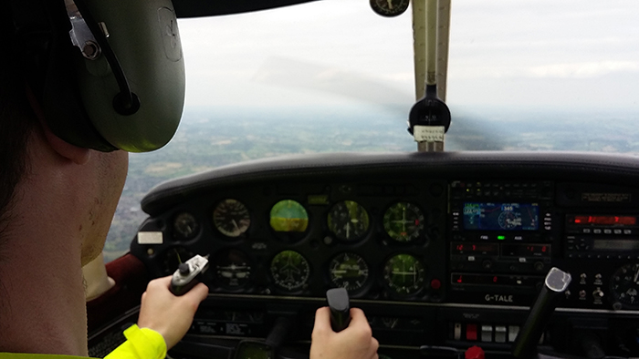 Bobby in control of the aircraft during his flying lesson