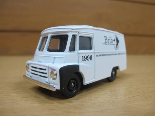 A front view of brib die-cast model van out of box