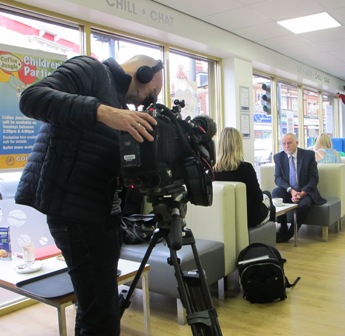 BBC cameraman films Sandwell Councillor Bob Piper and BBC Special Correspondent Katie Razzall in  Coffee Junction - Aug 2015