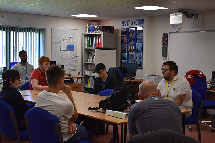 QAC former student Charlie speaking to Sport students and staff