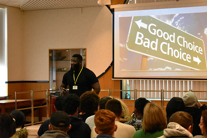 Craig Pinkney addressing QAC students in the main hall during his presentation