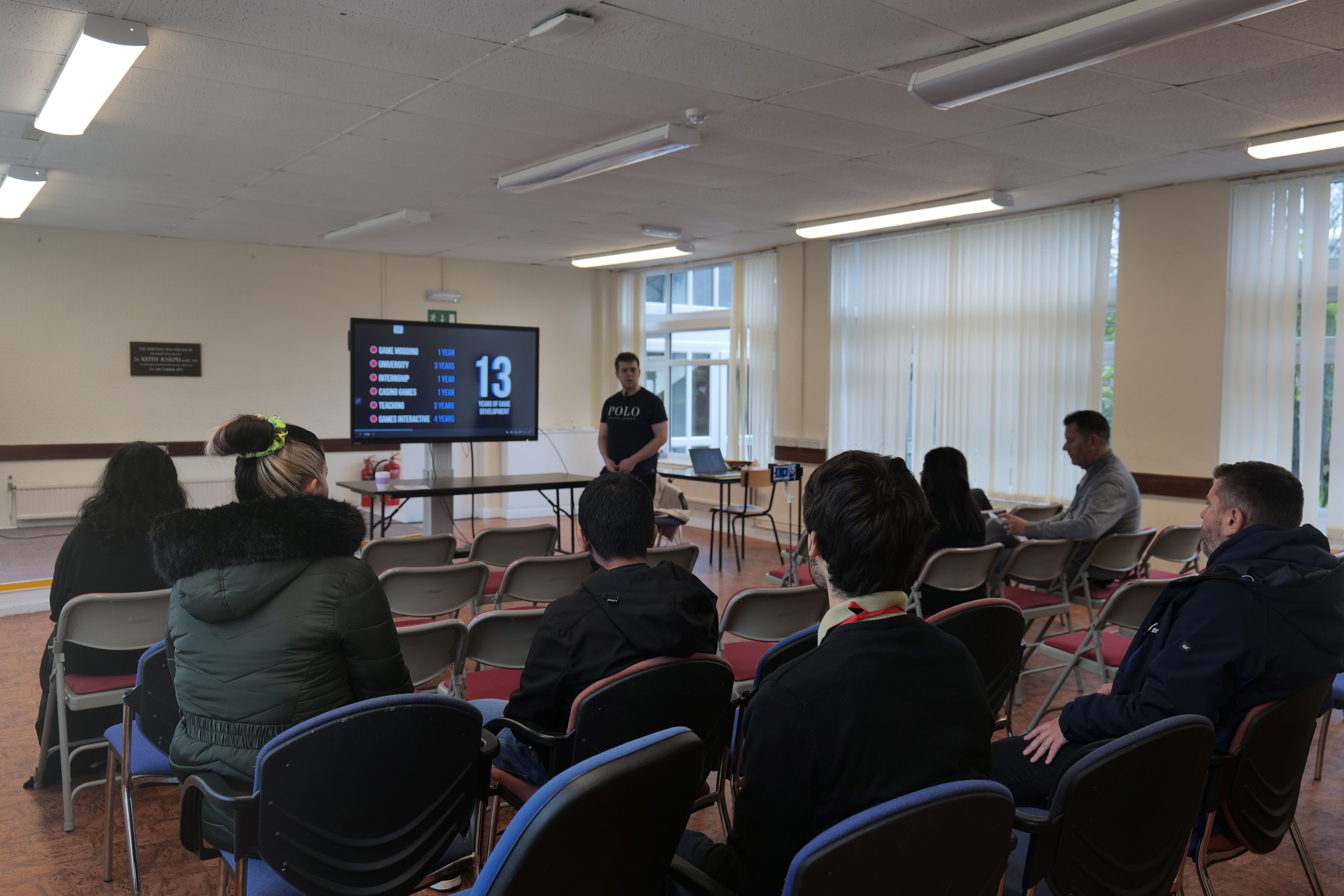 Image of Jake talking to a group of students