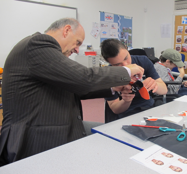 QAC Principal Hugh Williams working with student during WE Week exercise by Hobbycraft