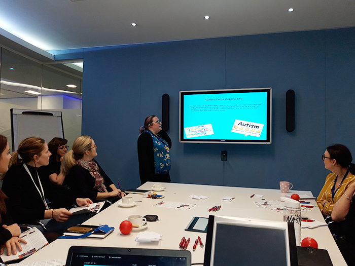 Student Jasmine presents in front of Barclays staff