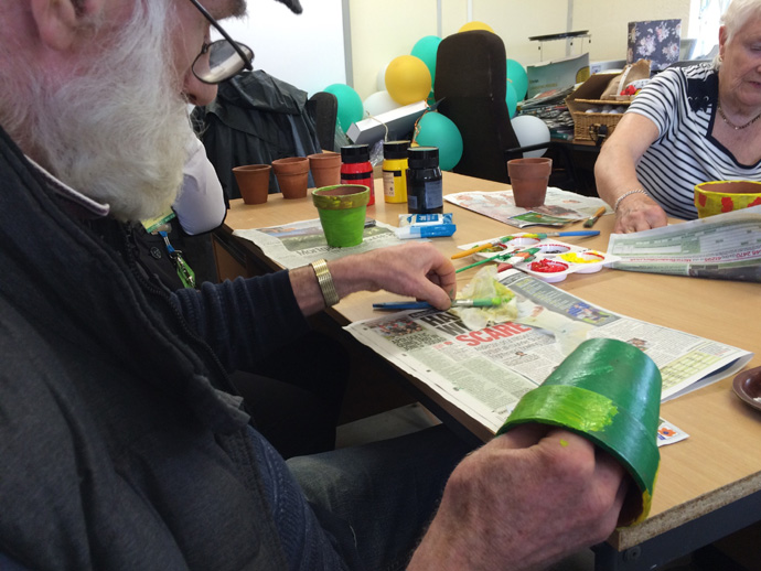 Members of the group decorating plant pots during the Dementia workshop