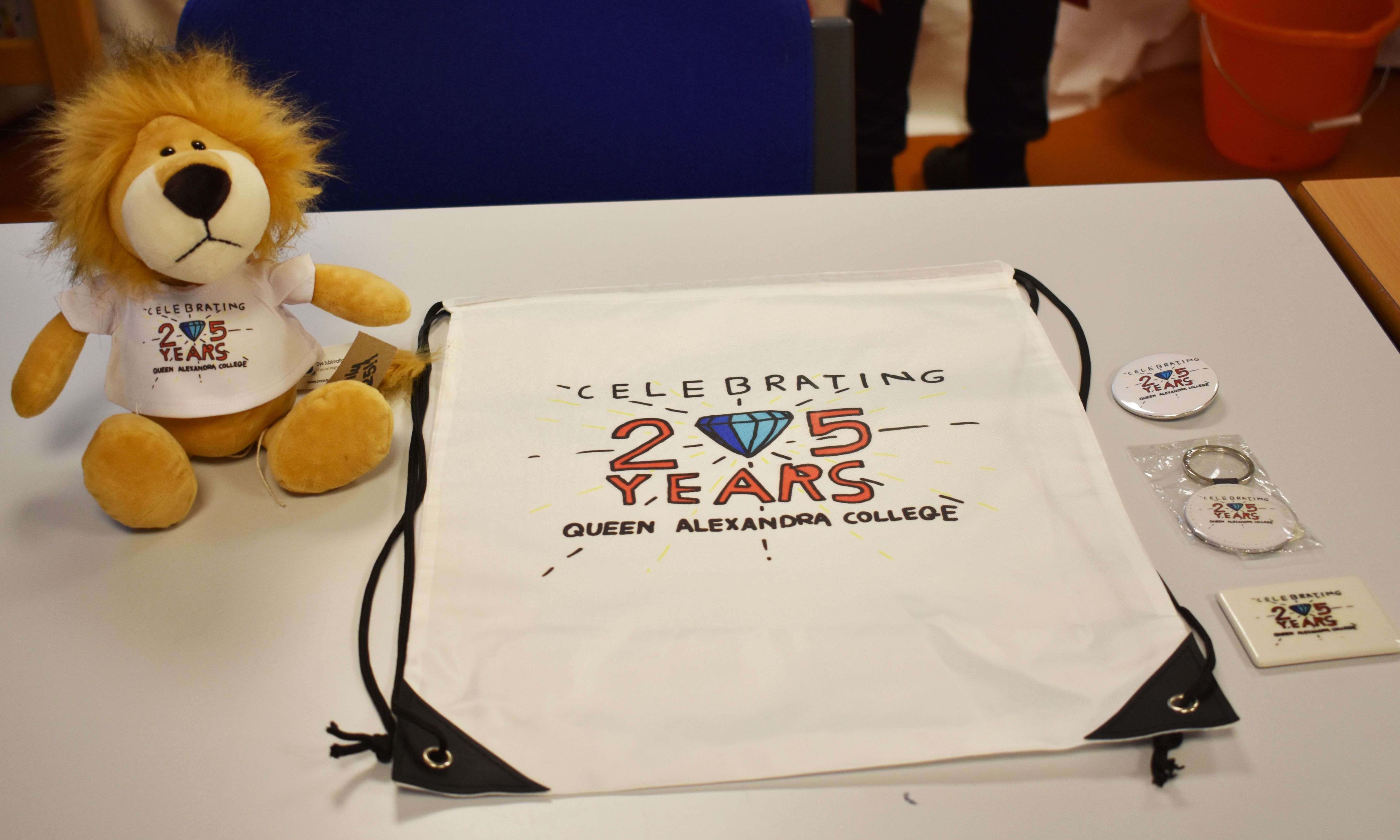 A range of merchandise with the 25th anniversary logo