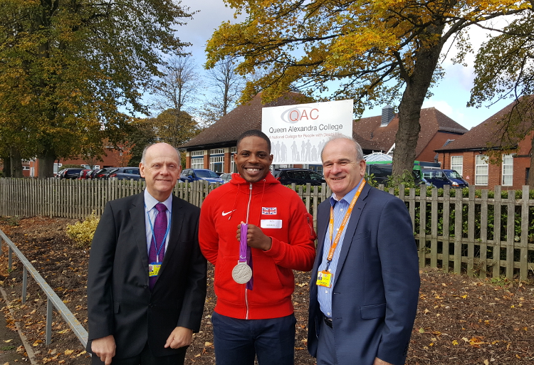 QAC Principal Hugh Williams, QAC Chair of Governors Chris Bradshaw and QAC Patron Mikail Huggins posing for photo