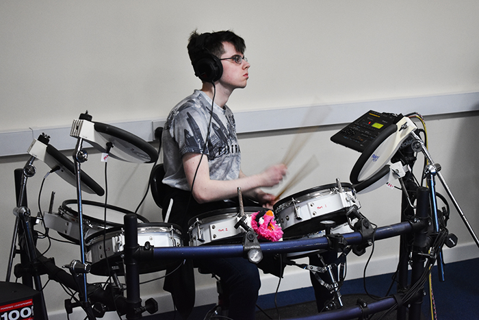 QAC student recording drums for the music piece