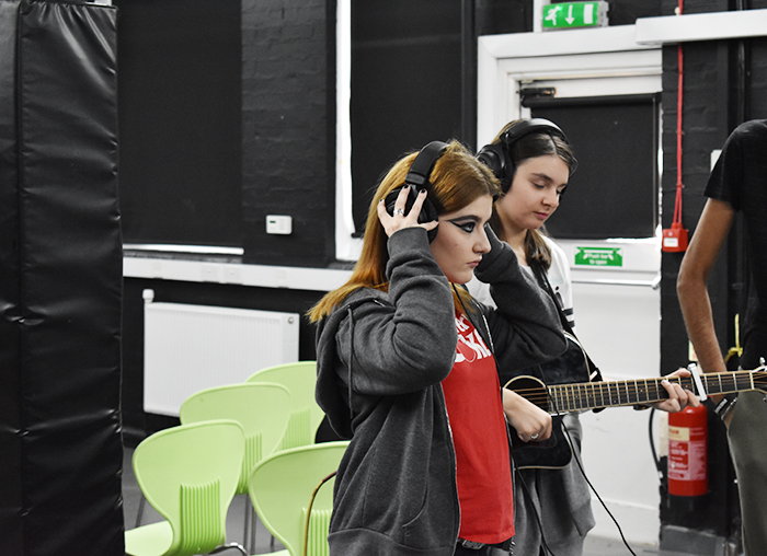 QAC Students preparing to record vocals for the music piece