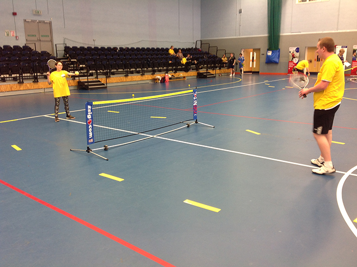 QAC tennis players Eve and Adam practicing at the Natspec games