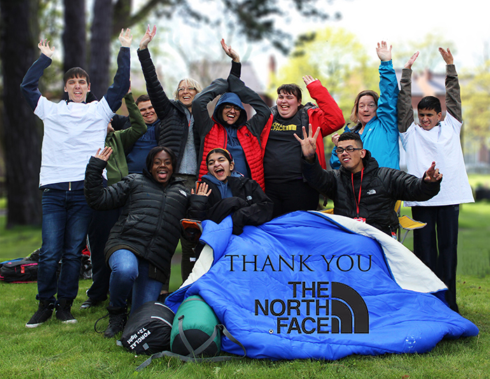 The DofE group at QAC posing for a photo with whilst displaying items from the donation received from The North Face