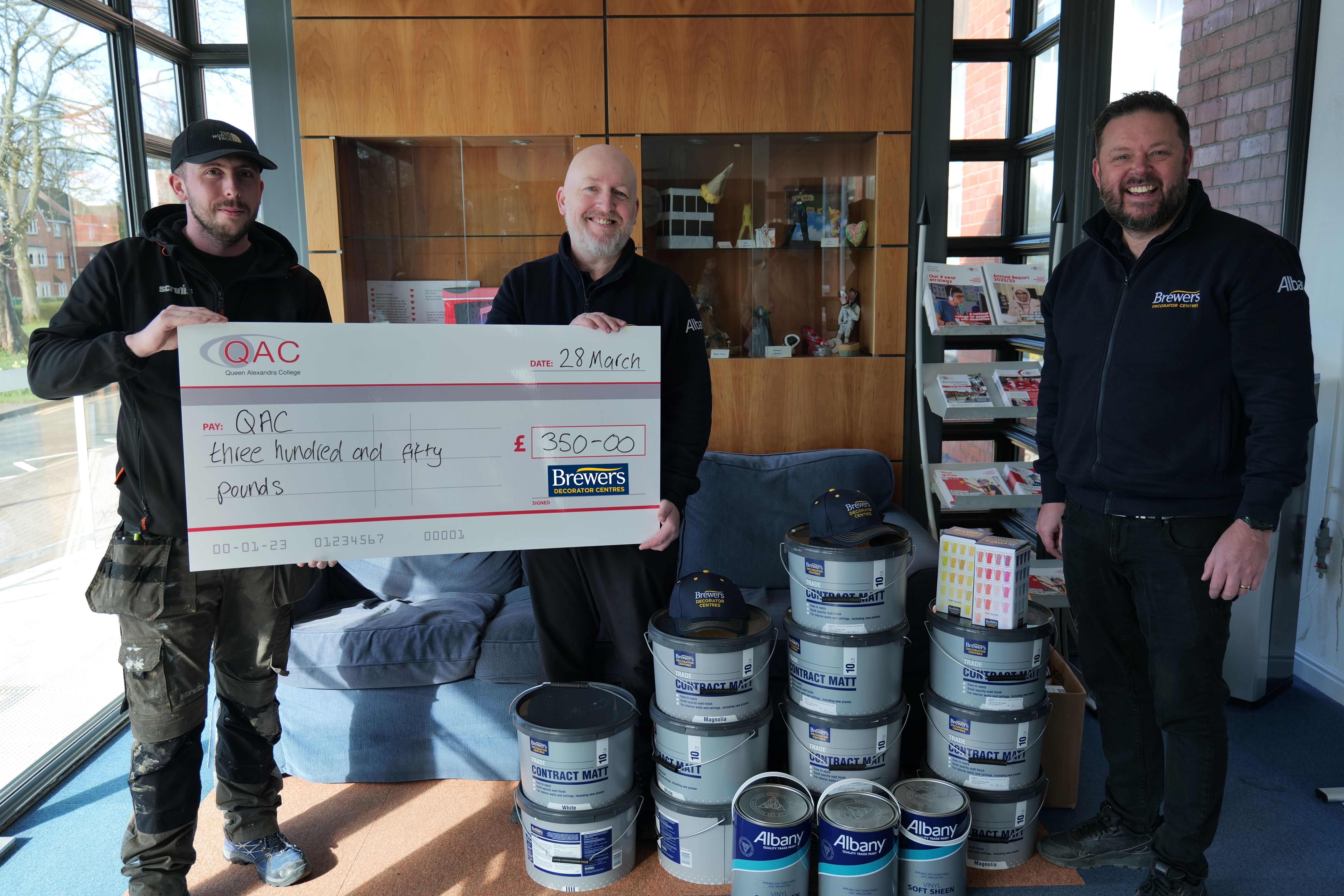 Picture shows Dean and Darron from Brewers Decorator Centre in Minworth with Dan from QAC's Maintenance Team.