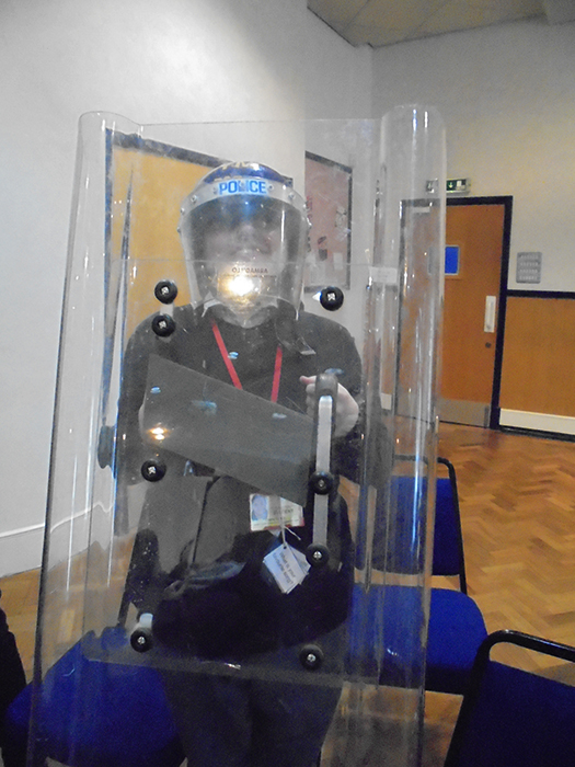 Another QAC student happy to try on Police riot gear