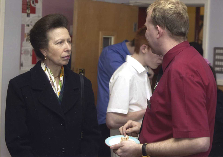 HRH The Princess Royal speaking to a QAC member of staff during her 2004 visit