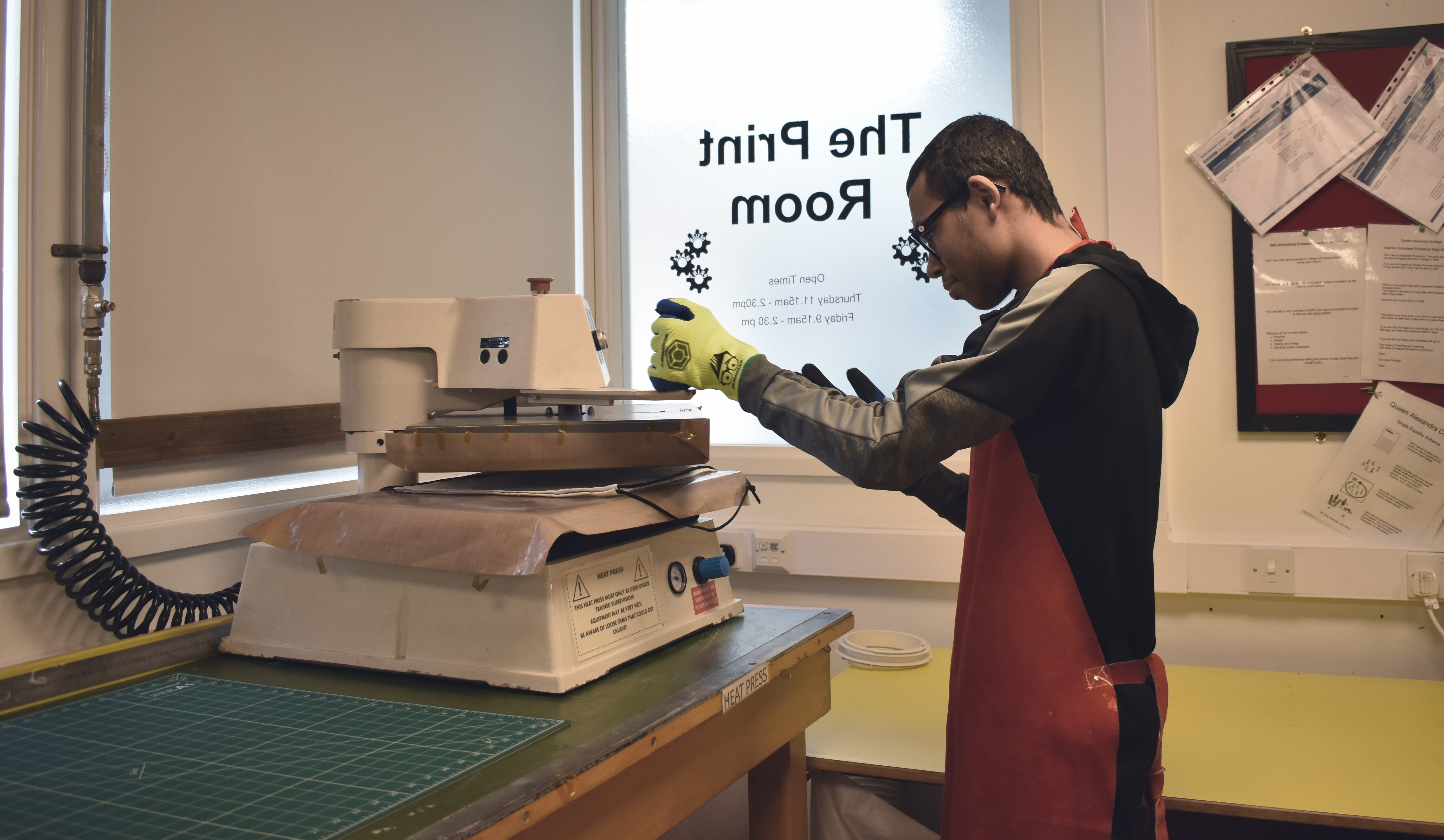 QAC student using a printing machine