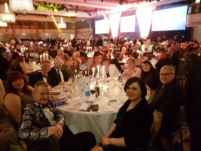 QAC staff sit around a table at the Tes FE Awards ceremony 