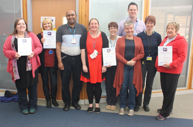 QAC staff with Certificate of Achievement 