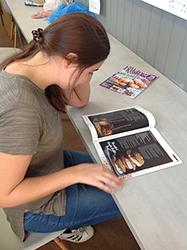 QAC student reads Baking Heaven Magazine