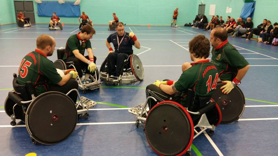 Players warm up before wheelchair rugby game 