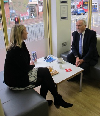 Sandwell Councillor Bob Piper and BBC Special Correspondent Katie Razzall sit at a table in  Coffee Junction and talk - Aug 2015