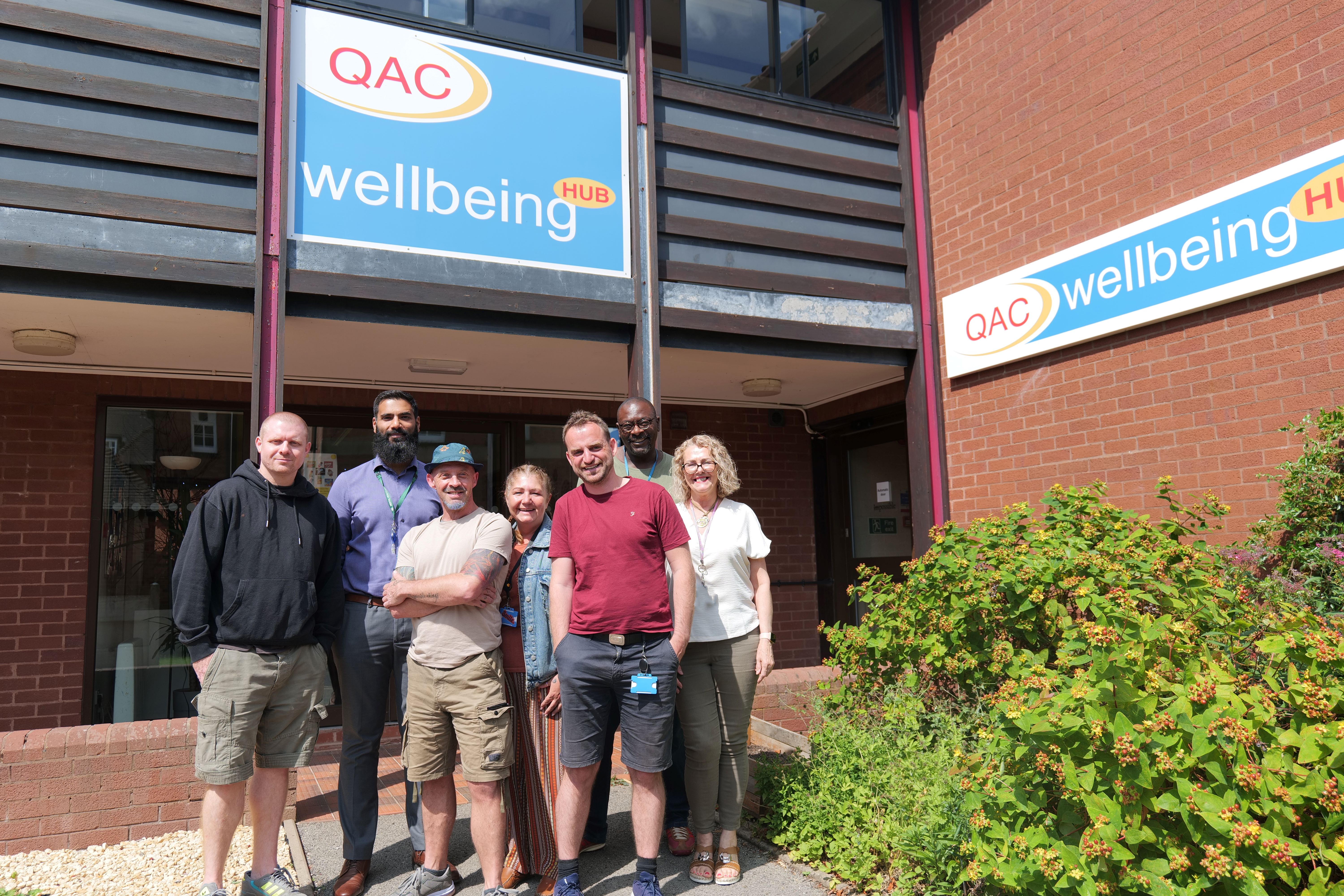 Wellbeing hub staff in front of the hub