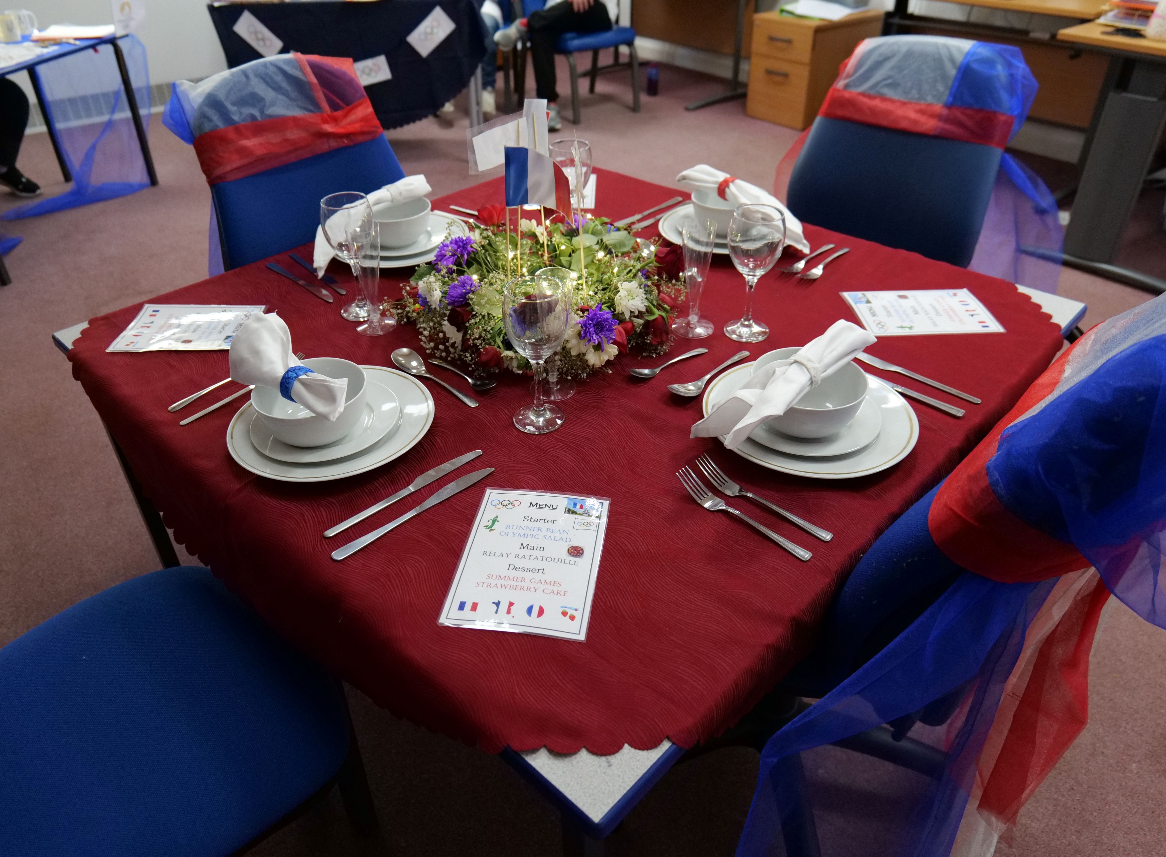 Table decorated for Olympics themed meal