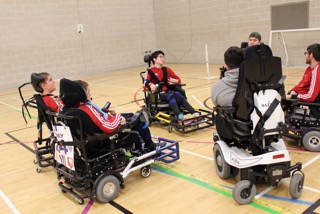 QAC Powerchair Football team grouped up prior to the game vs Telford