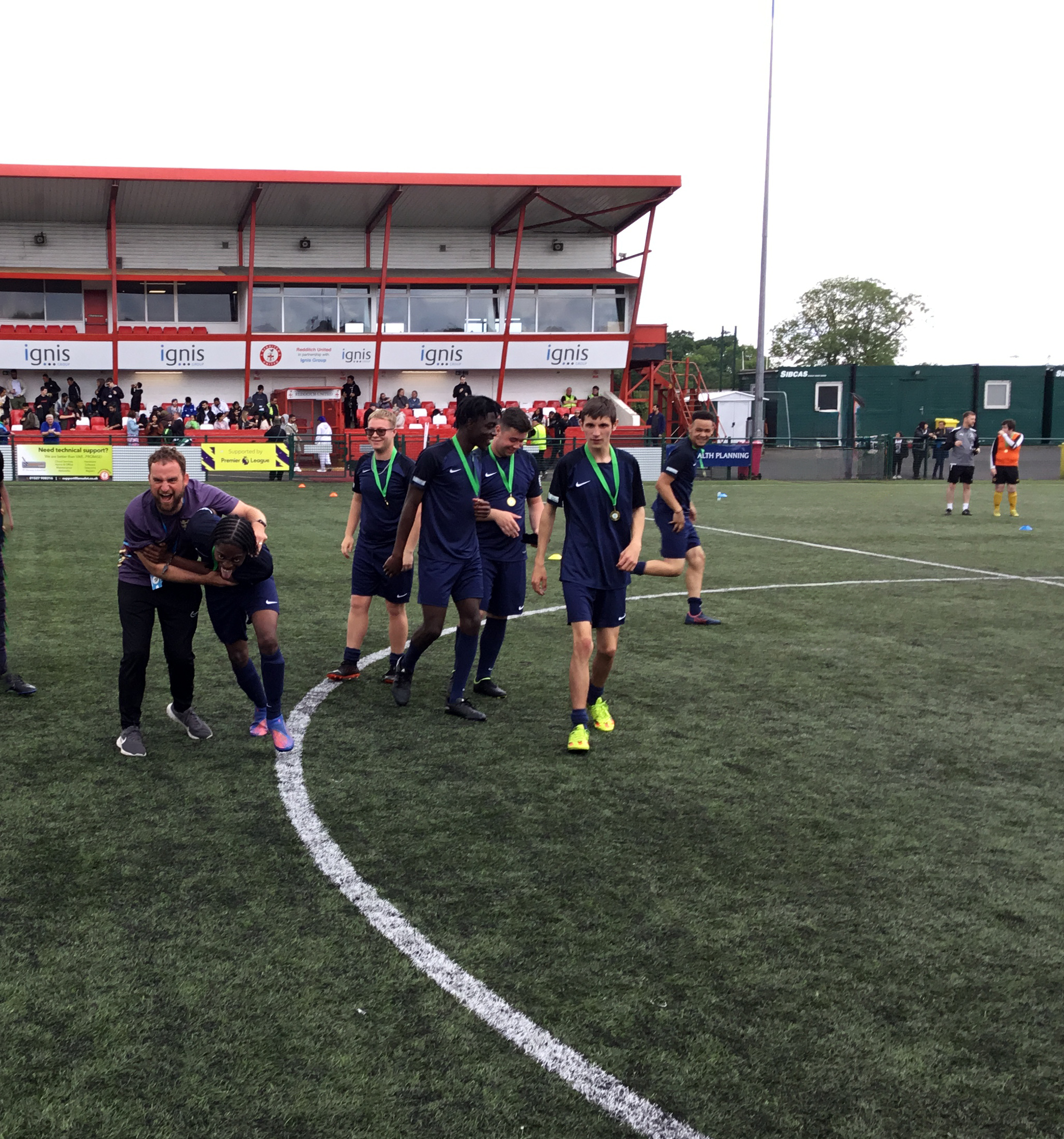 Football team celebrating and walking 