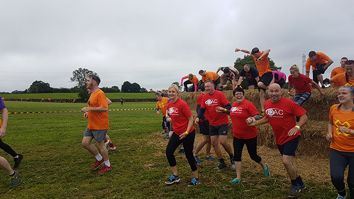 Runners tackling an obstacle during the Xrunner race