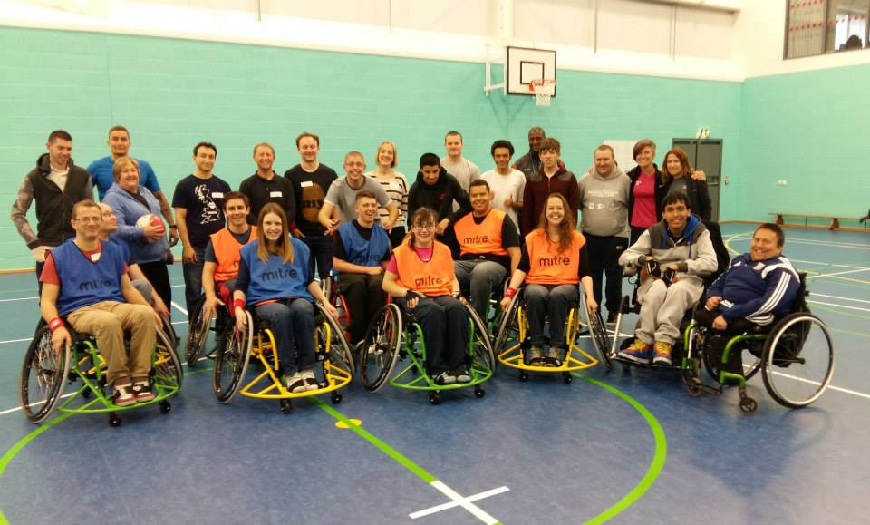 QAC Students and visitors from zurich insurance play wheelchair basketball