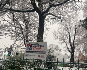 QAC sign with snow